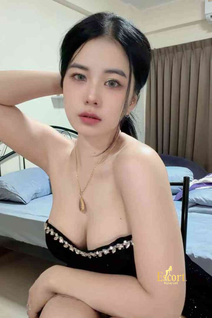 Escort Malay Girl Adeline, a 22yo Thailand Escort in KL, poses in black lingerie with a C cup KL Escort Girl Service