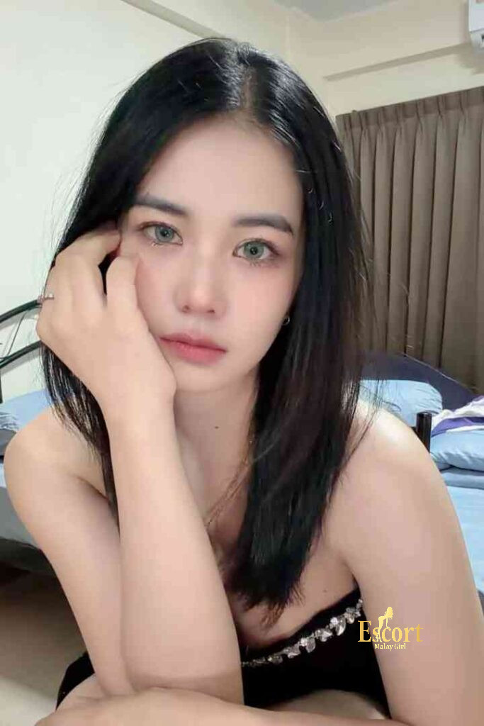 Escort Malay Girl Adeline, 22yo C Cup Thailand escort, posing indoors KL Escort Girl Service