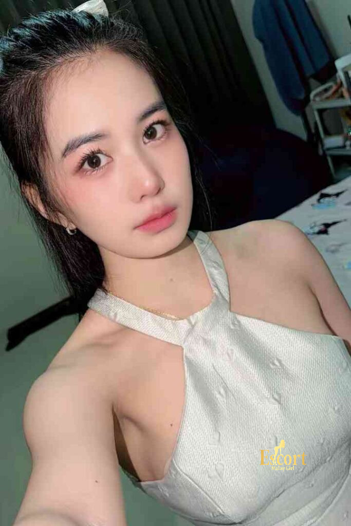 Escort Malay Girl Adeline, 22yo Thailand escort with C cup, wearing a white dress KL Escort Girl Service
