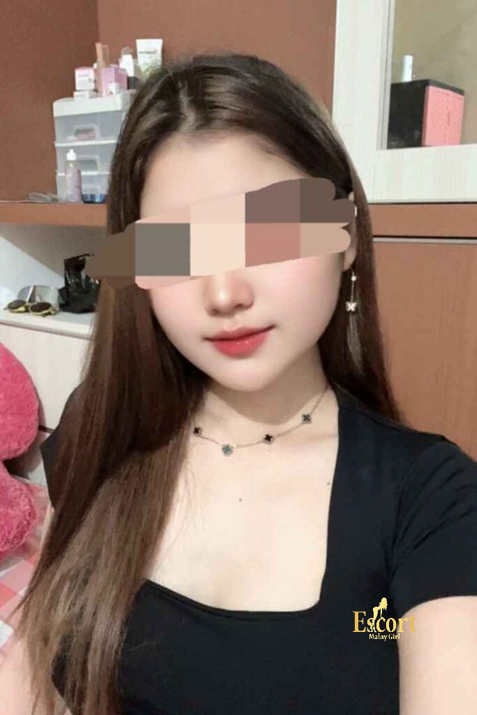 Escort Malay Girl Amina, a 22-year-old petite Malay escort in Kuala Lumpur, is featured in this image. KL Escort Girl Service