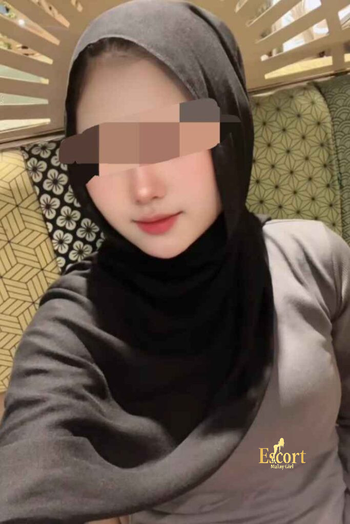 Escort Malay Girl Amina, 22, petite Malay escort in Kuala Lumpur, wearing a hijab. KL Escort Girl Service