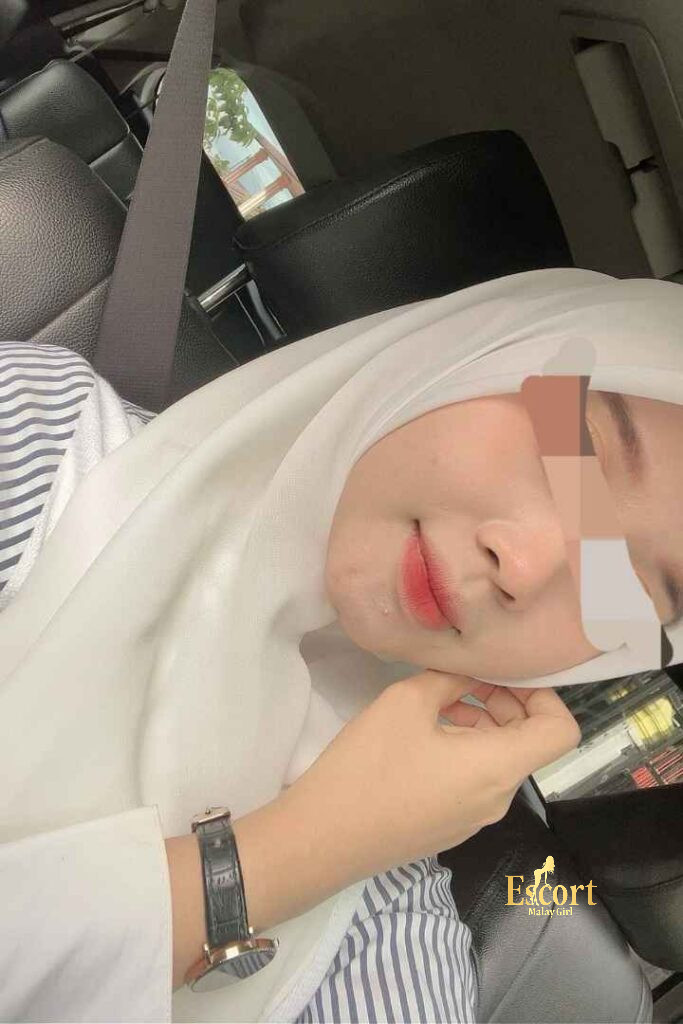 Escort Malay Girl Eika Malay Escort girl in hijab, close-up of face with blurred features. KL Escort Girl Service