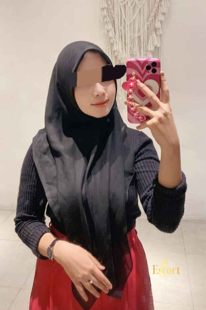 Escort Malay Girl Eika Malay Escort: Woman in hijab holding phone, Cheras Call Girl KL Escort Girl Service