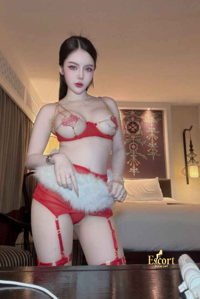 Escort Malay Girl Grace Thailand Escort in red lingerie posing in a hotel room KL Escort Girl Service