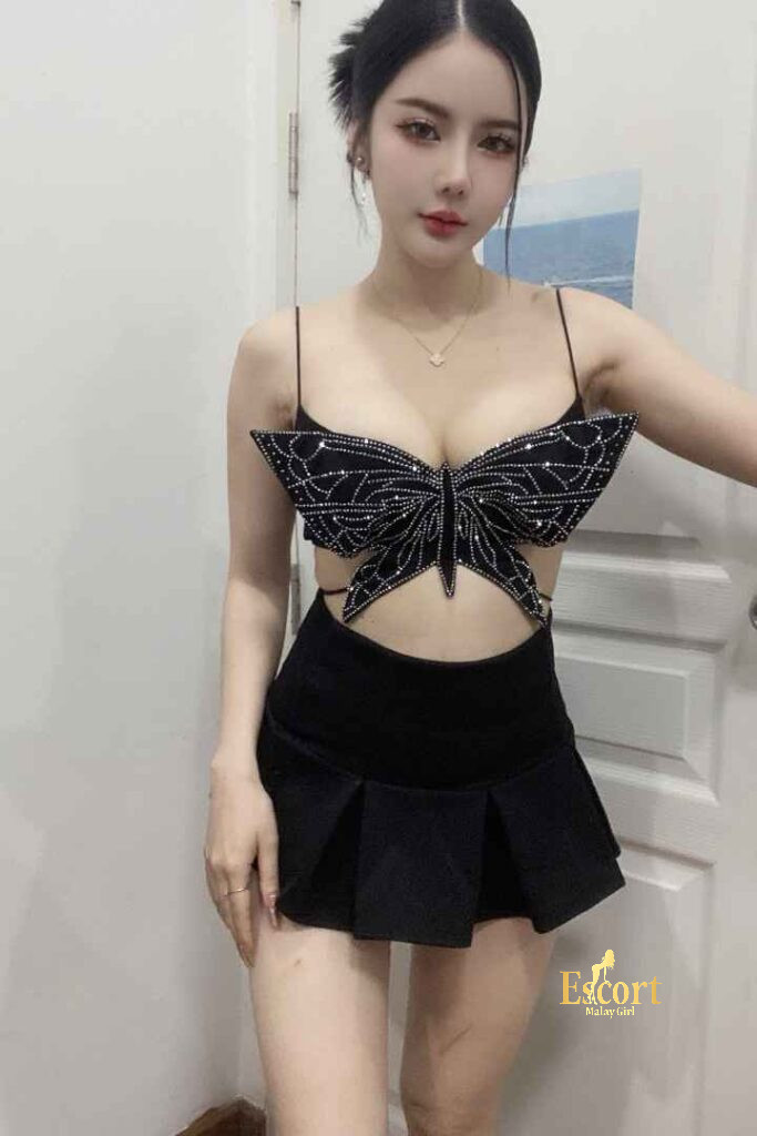 Escort Malay Girl Grace Thailand escort in a butterfly top and black skirt KL Escort Girl Service