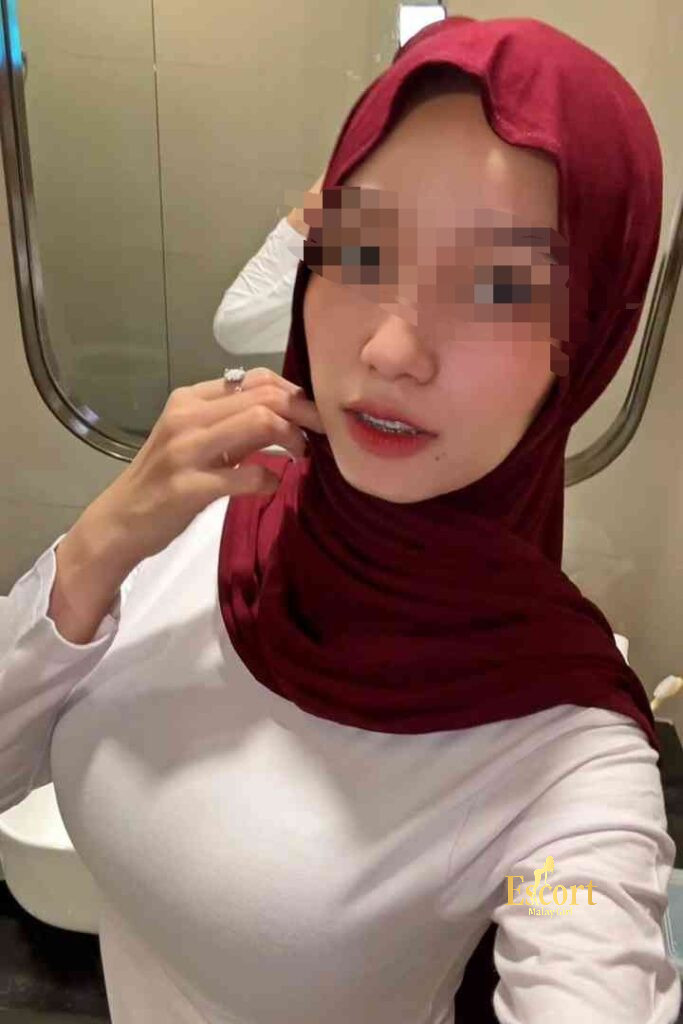 Escort Malay Girl Kirana, a 23yo Malay escort with C cup, taking a selfie in a bathroom KL Escort Girl Service
