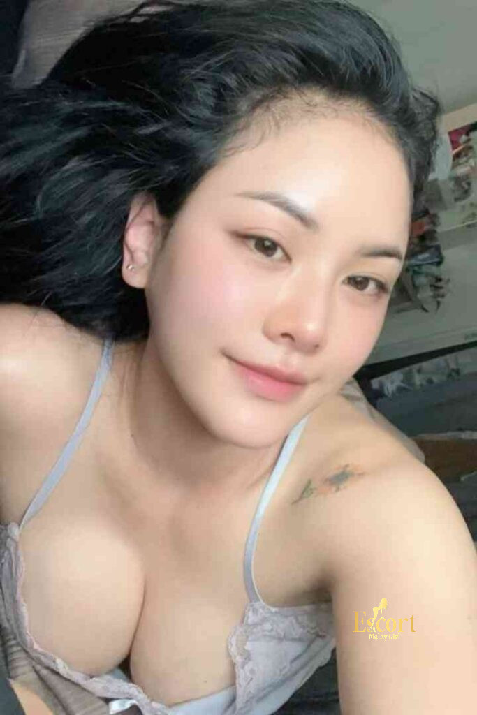 Escort Malay Girl Lainey, a 23-year-old Thai escort in Kuala Lumpur with C cup, poses for a photo KL Escort Girl Service