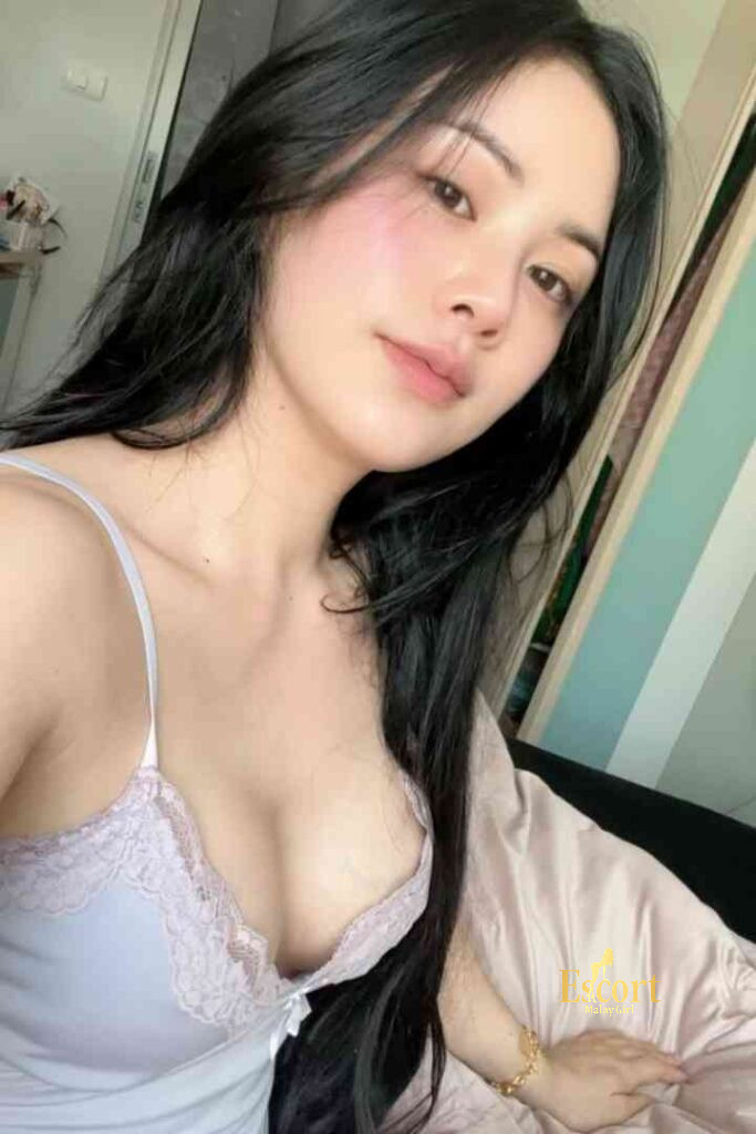 Escort Malay Girl Lainey, a 23-year-old Thai call girl and escort in Kuala Lumpur, with long black hair. KL Escort Girl Service