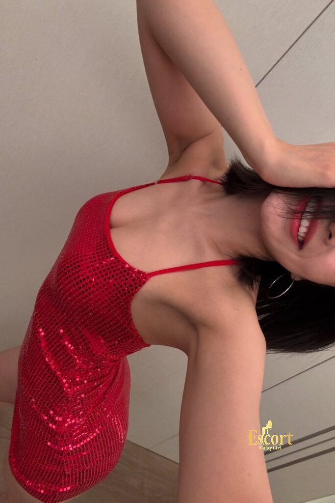 Escort Malay Girl Ling An, 23yo C cup Chinese escort in red sequin dress, smiling and posing KL Escort Girl Service