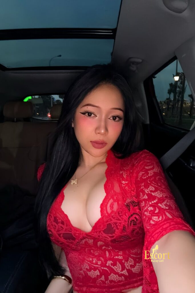 Escort Malay Girl Shawira, a 166cm Malay escort with C cups, in a red lace top. KL Escort Girl Service