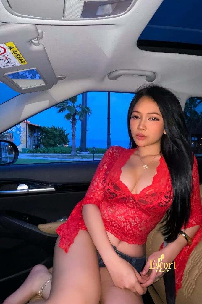 Escort Malay Girl Shawira, a 166cm Malay escort, in a red lace top in a car KL Escort Girl Service