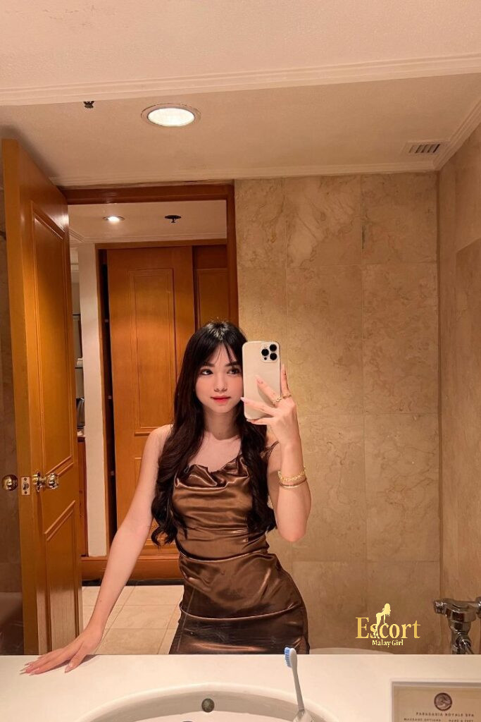 Escort Malay Girl Malay escort Zanis in brown dress taking selfie in bathroom KL Escort Girl Service